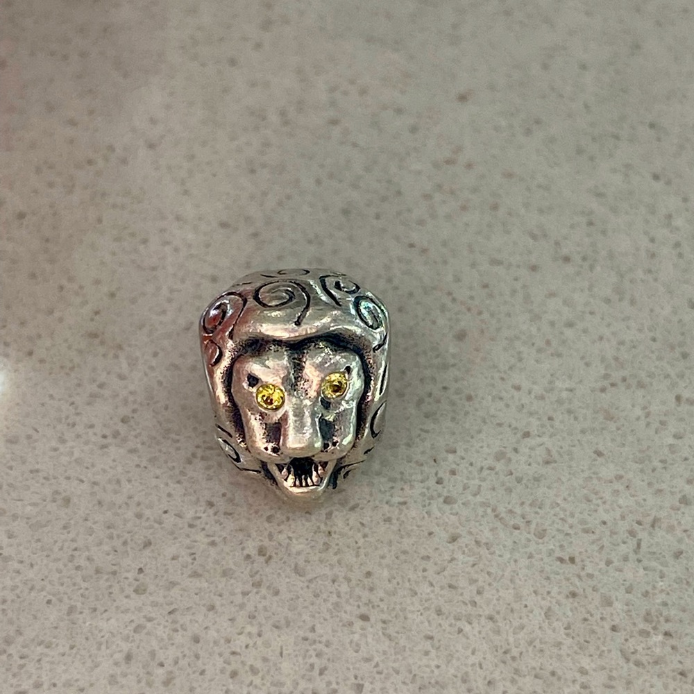 Retired Pandora lion charm with CZ eyes